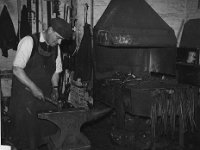 1955 f spain blacksmith in the old engineers shop.jpg